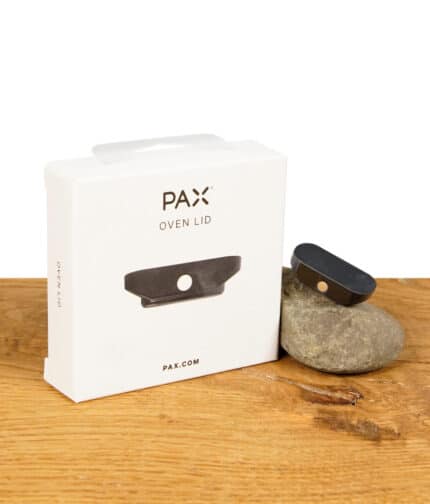 Pax Ofendeckel für volle Befüllung auf Stein liegend neben Verpackung